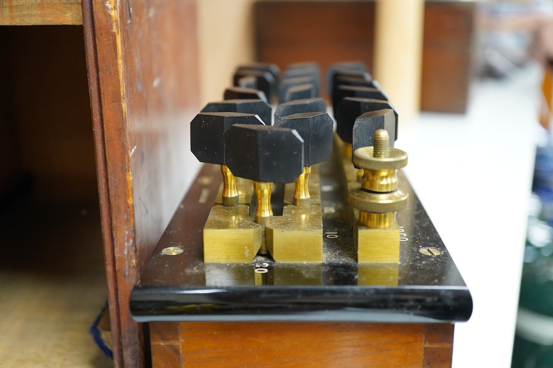 An early 20th century mahogany cased Wheatstone Bridge by C.J. Simmons, London, intended to measure electrical resistance, the case dimensions; 26cm x 14cm x 16.5cm, together with a leather cased brass Galvanometer, inte